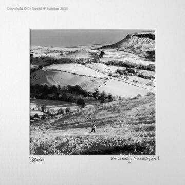 A snowboarder above village of Combs near Chapel-en-le-Frith and Whaley Bridge, near Buxton, Peak District